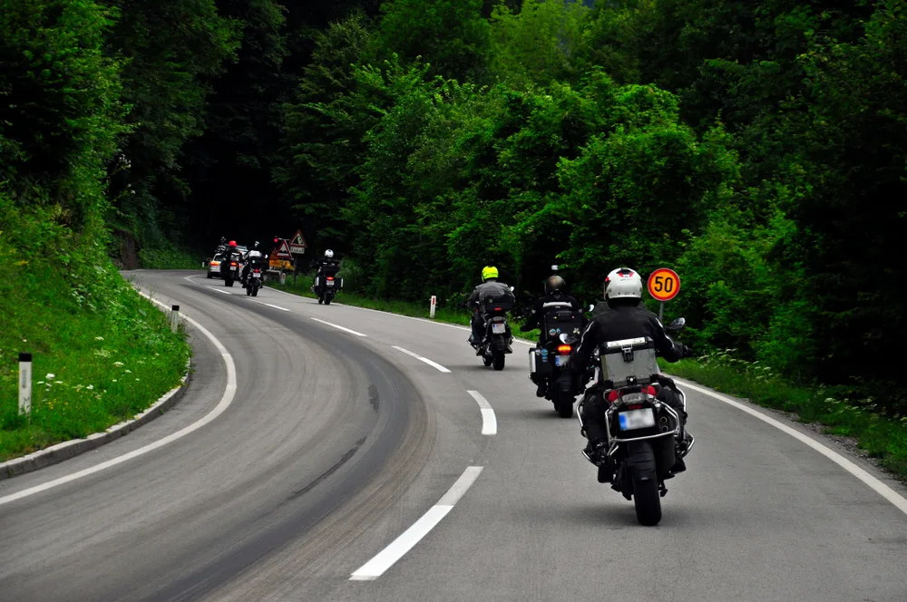 Motorcyclists riding together on a winding road